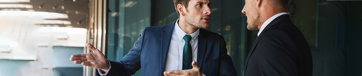 Two businessmen in a heated conversation