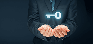 Open hands holding a glowing key